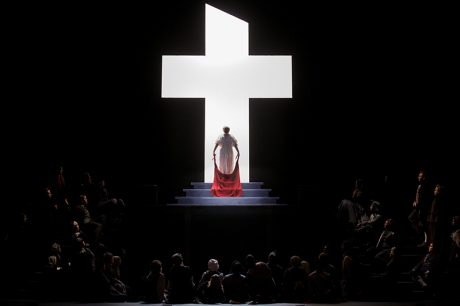 In the dramatic last moments of Dialogues of the Carmelites at Eastman Opera, Blanche makes her way to the guillotine bathed in the light of the cross. Photo by Nic Minetor