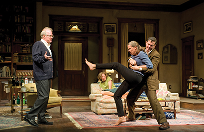 The set has a realistic, lived-in look, with a de-saturated palette that keeps the focus on the four central characters. Photos by Michael Brosilow