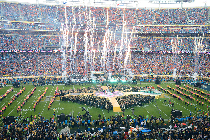 A marching band joined All Access' stage on the field.