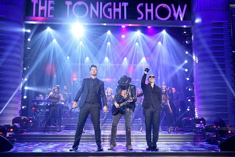Robin Thicke and Joe Perry joined Pitbull on the Tonight Show’s L.A. set. Travis Barker also performed.