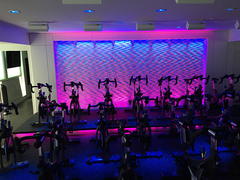The wall consists of 8 COLORdash Batten-Hex 8 linear washes and 12 Ilumipod LOGIC Tri-4 RGB color mixing fixtures.