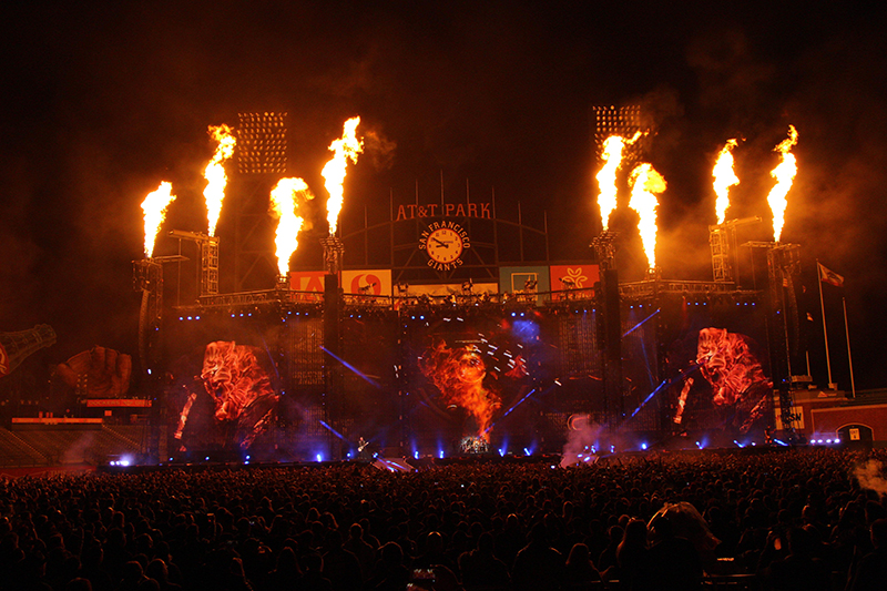 Flashes of pyro alternated with punches from LED fixtures at AT&T Park for the band's Super Bowl Weekend show.