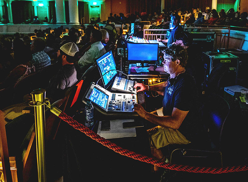 Lighting designer Danny Sinclair manning the tour’s Avolites Quartz lighting control console and Titan Mobile Wing. Photo by Philip Macias