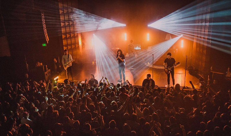 The gear list includes Rogue R1 Spots, Nexus 4x1 bars plus a Chauvet DJ DMX-4 Dimmer Pack to control the band's table and floor lamps that are part of their set.